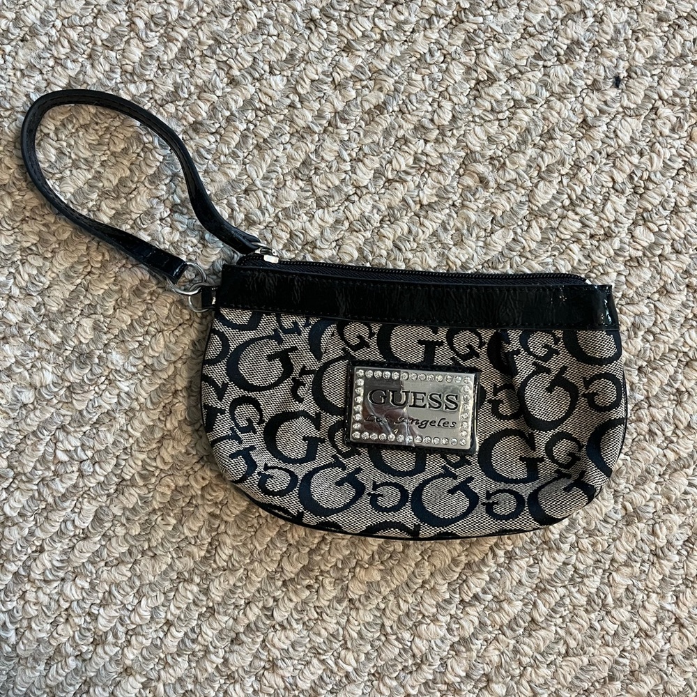 GUESS wristlet with signature logo. NWOT. Never used.
